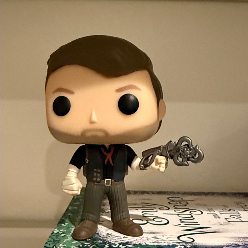 Funko Pop Figure with Black Shirt and Brown Hair